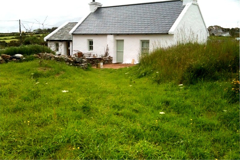 After restoration work on a traditional stone cottage by Pat Harkin Stonework & Restorations, Donegal, Ireland